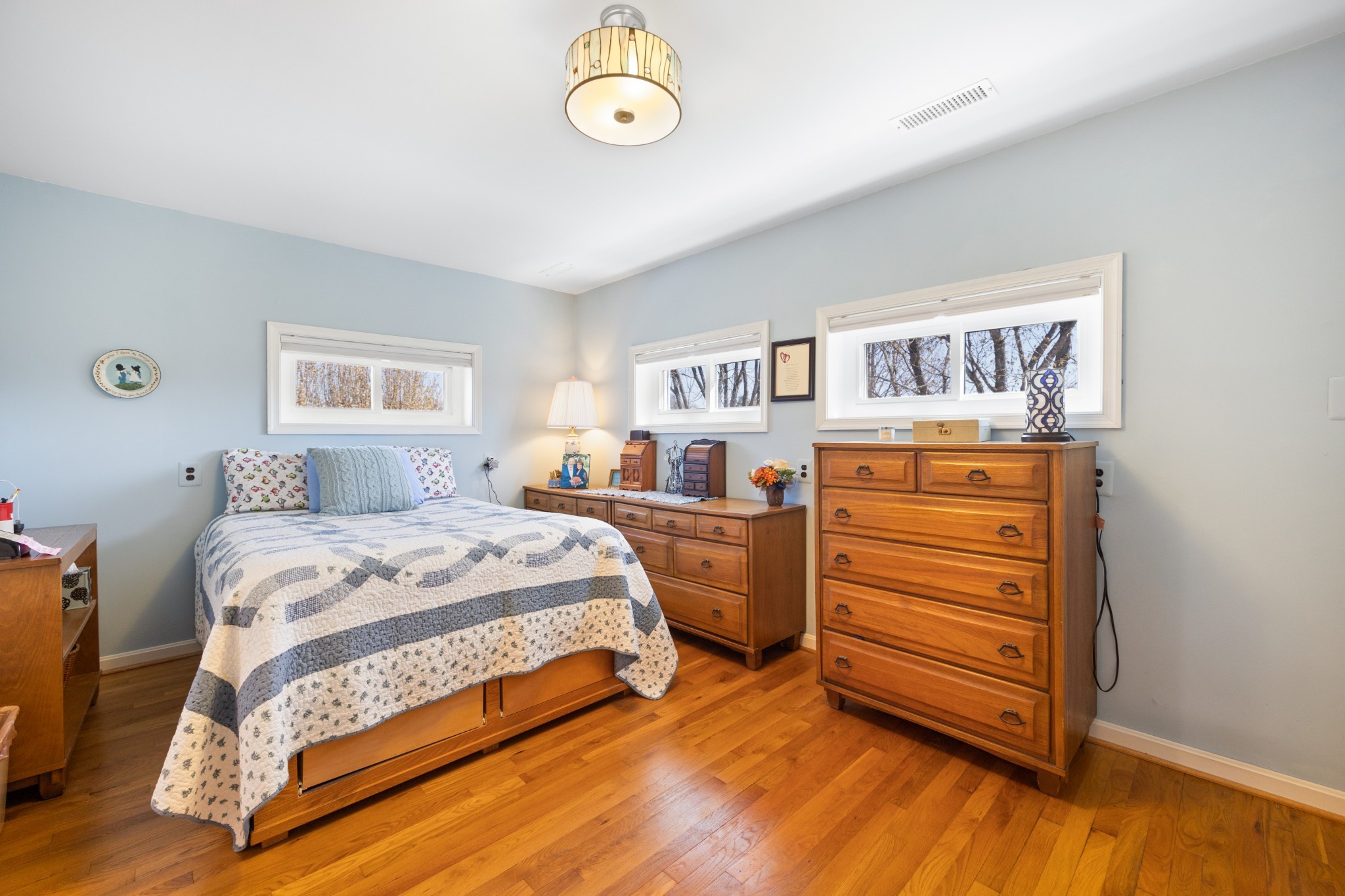 205 Gwynn Road, Unit HANGAR #8 Lebanon, TN 37090 - Photo 24 of 35 a bedroom with a bed and a dresser