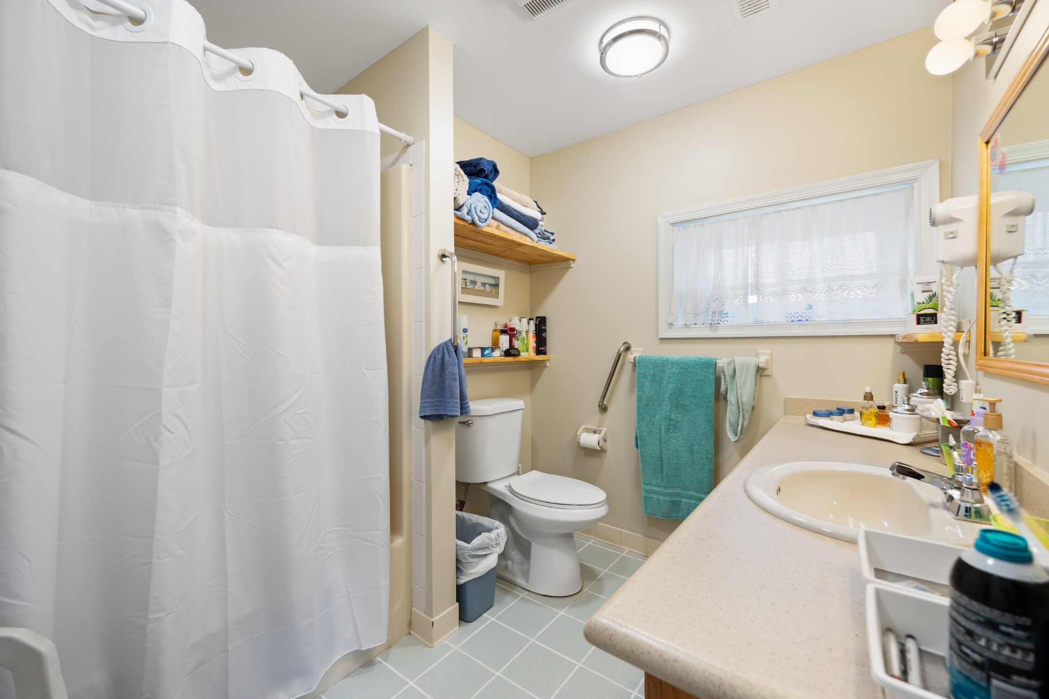205 Gwynn Road, Unit HANGAR #8 Lebanon, TN 37090 - Photo 25 of 35 a bathroom with a sink toilet and window