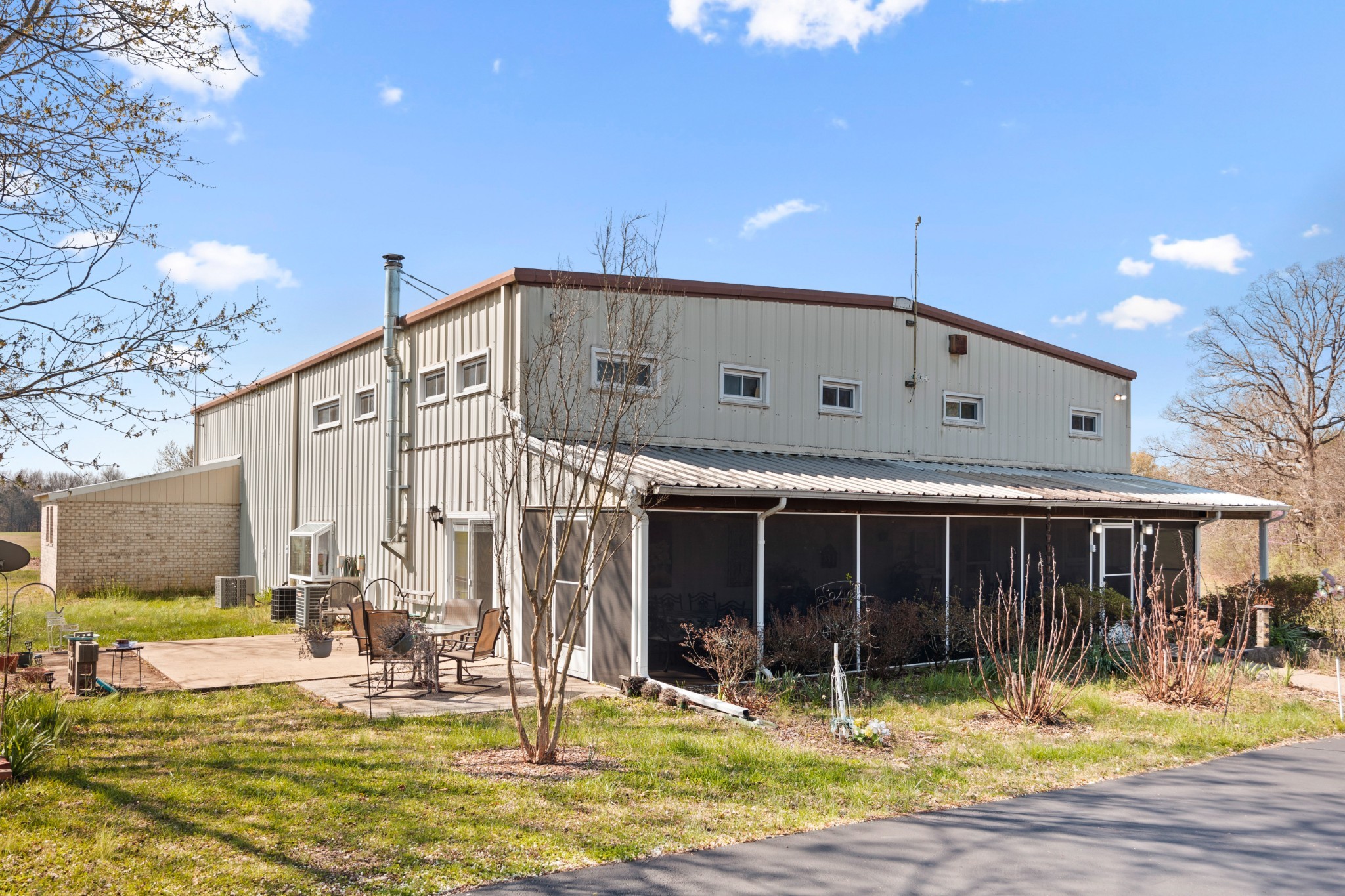 205 Gwynn Road, Unit HANGAR #8 Lebanon, TN 37090 - Photo 3 of 35 a front view of a house with a yard outdoor seating and garage