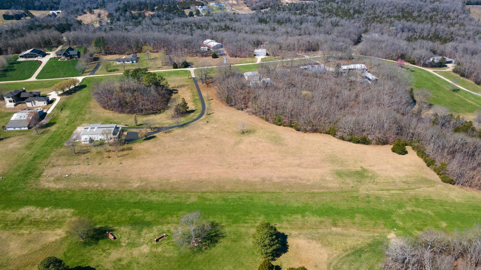 205 Gwynn Road, Unit HANGAR #8 Lebanon, TN 37090 - Photo 4 of 35 a backyard of a house with lots of green space