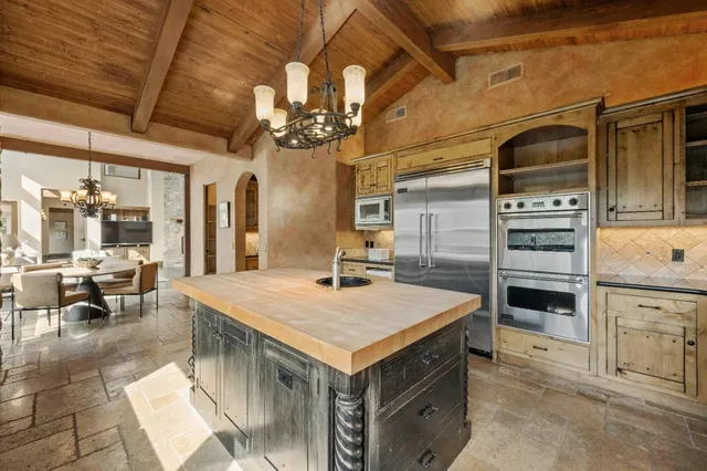 a living room with fireplace furniture and a flat screen tv