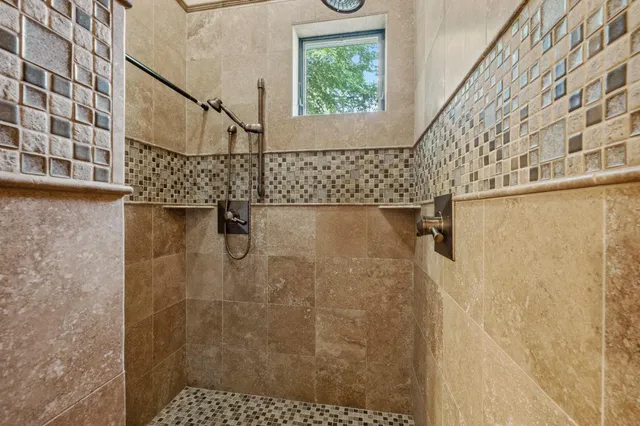 a view of a livingroom with wooden floor and stairs