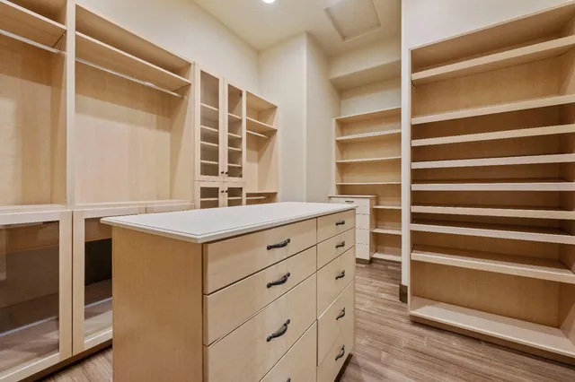 a view of a room with wooden floor windows and entryway