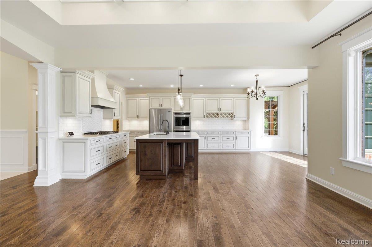 35339 West 13 Mile Road Farmington, MI 48331 - Photo 8 of 72 Kitchen with tasteful backsplash, dark wood-type flooring, stainless steel appliances, hanging lights, and dual tone cabinetry