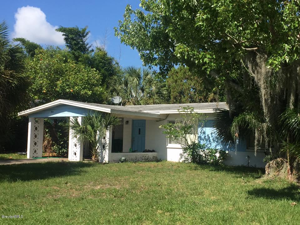 304 3rd Street Merritt Island, FL 32953 - Photo 1 of 6 a front view of a house with garden