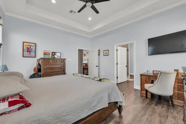 a bedroom with a bed a chair and couch