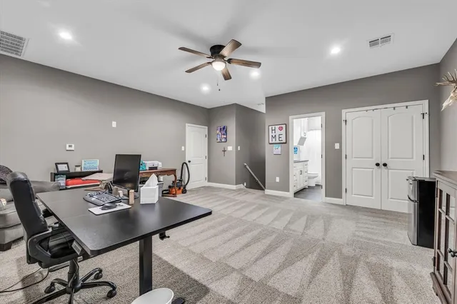 a view of a workspace with furniture