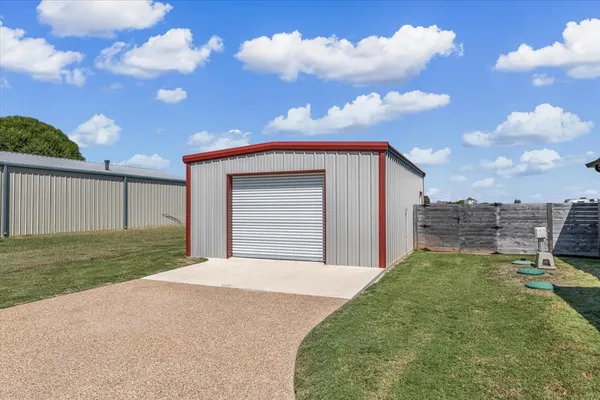 a view of a backyard with a garden