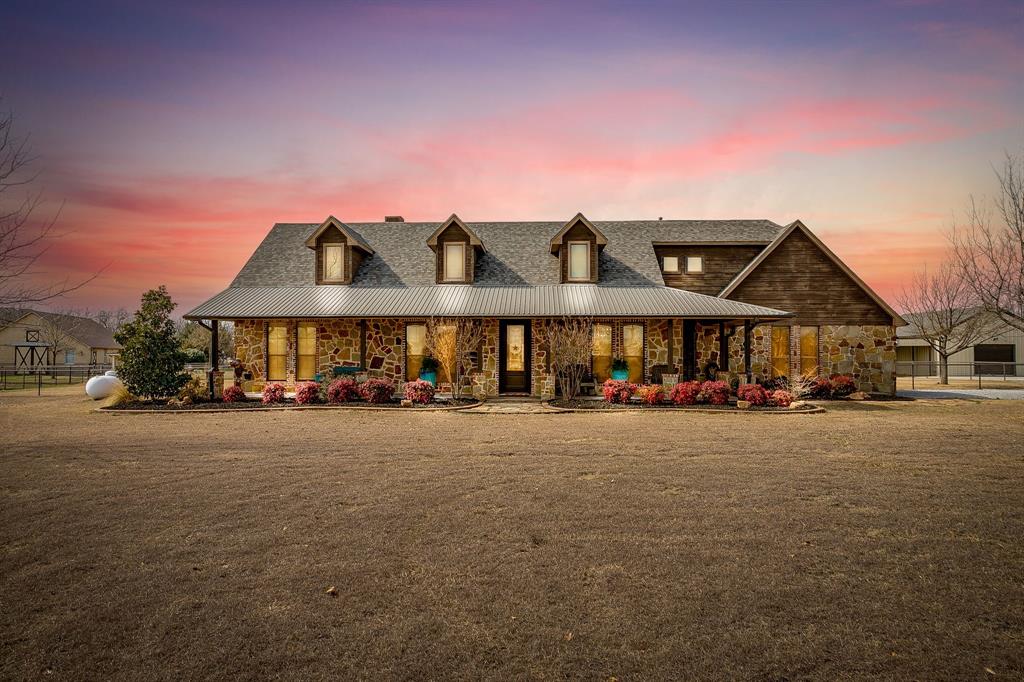 a view of a big house with a street