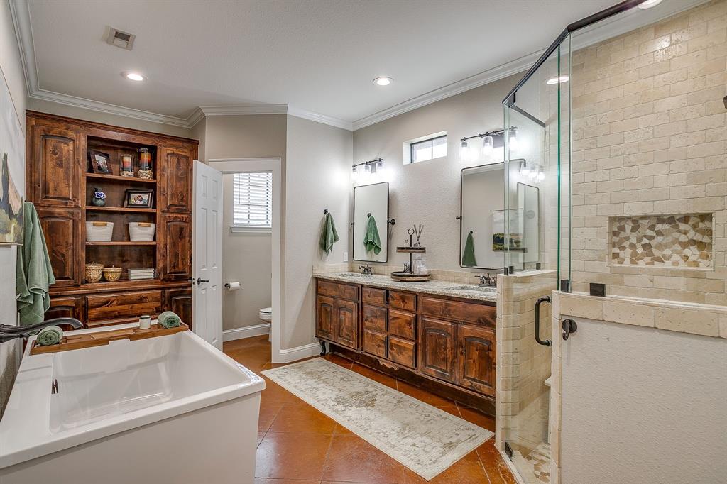 160 Goodnight Trail Rhome, TX 76078 - Photo 16 of 40 a bathroom with a tub sink and mirror