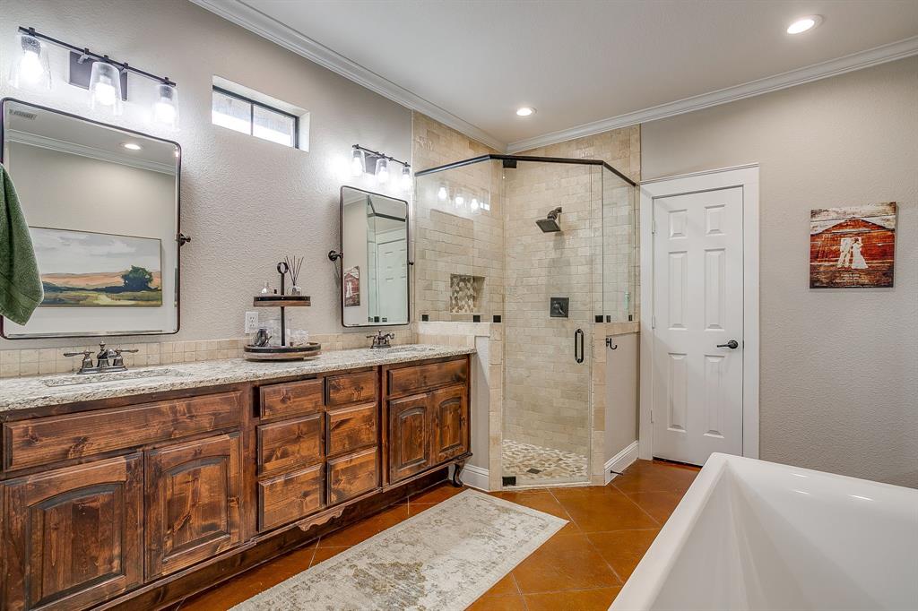 160 Goodnight Trail Rhome, TX 76078 - Photo 18 of 40 a spacious bathroom with a shower sink and mirror