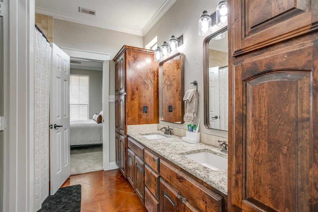 160 Goodnight Trail Rhome, TX 76078 - Photo 22 of 40 a bathroom with a granite countertop sink and a mirror