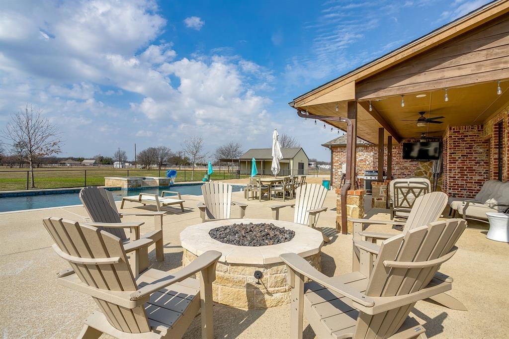160 Goodnight Trail Rhome, TX 76078 - Photo 28 of 40 a view of a patio with swimming pool table and chairs