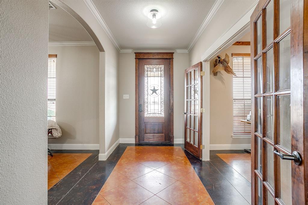 160 Goodnight Trail Rhome, TX 76078 - Photo 4 of 40 a view of front door with hallway and wooden floor