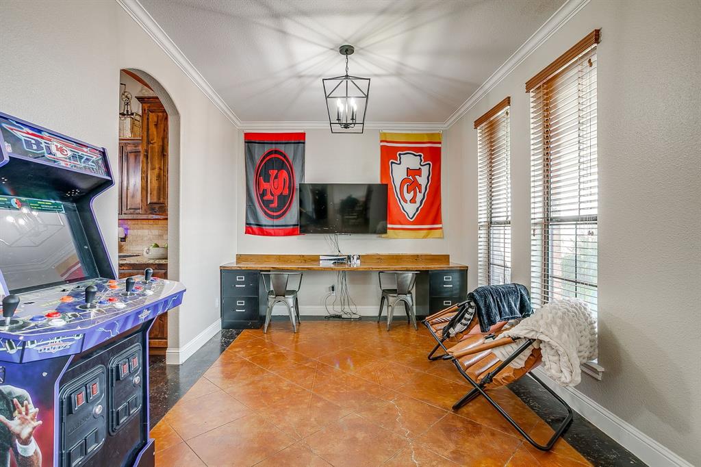 160 Goodnight Trail Rhome, TX 76078 - Photo 6 of 40 a work room with furniture a chandelier and a window