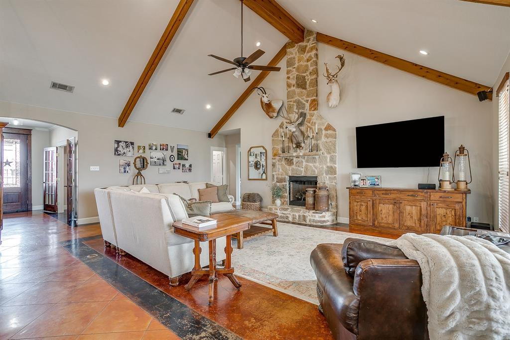 160 Goodnight Trail Rhome, TX 76078 - Photo 9 of 40 a living room with furniture and a flat screen tv