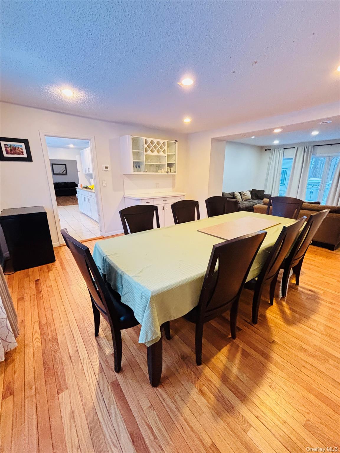 929 Fox Meadow Road Yorktown Heights, NY 10598 - Photo 22 of 39 Massive size dining room joins a comfy family room at the rear which opens on to a nice deck for outdoor entertaining and grilling.