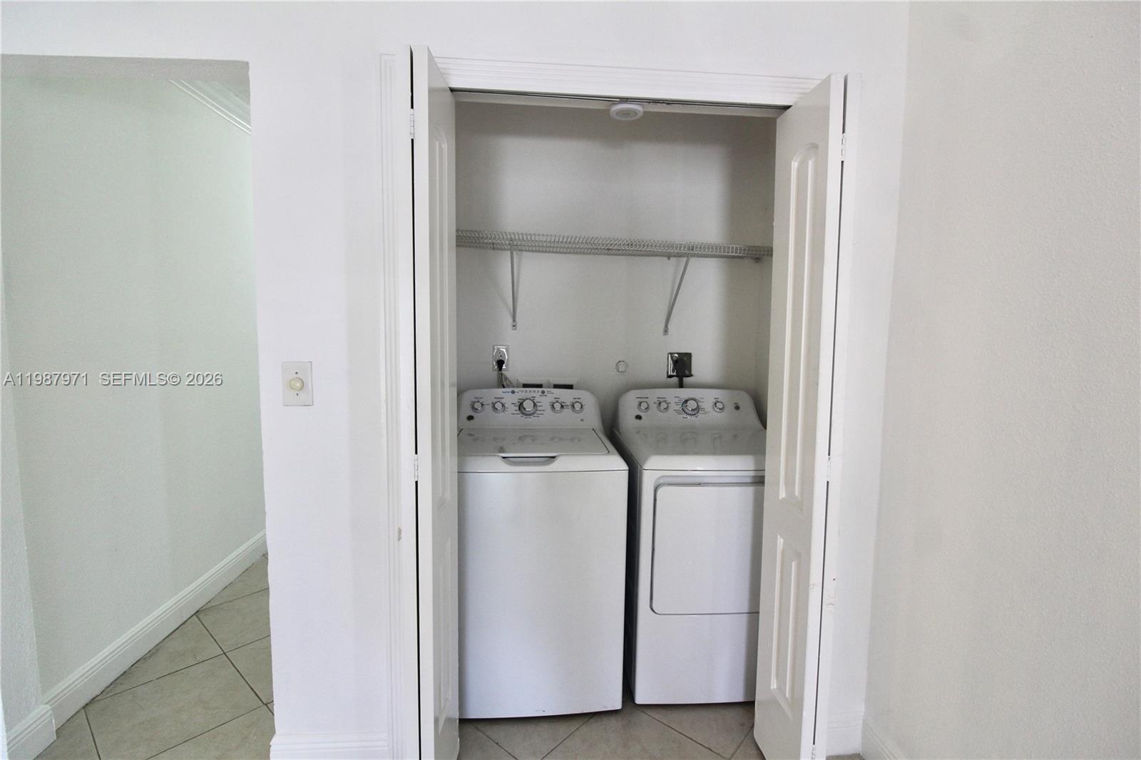 5160 Southwest 8th Street Margate, FL 33068 - Photo 13 of 23 a utility room with dryer and washer