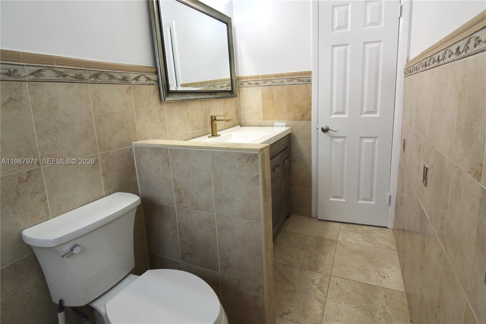 5160 Southwest 8th Street Margate, FL 33068 - Photo 21 of 23 a bathroom with a sink a toilet and shower