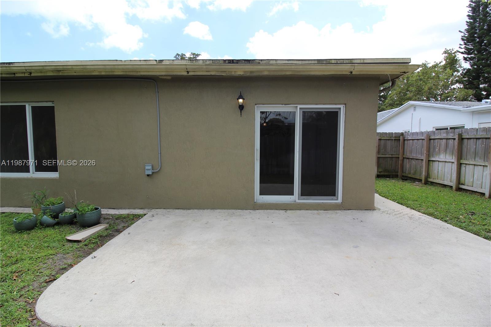 5160 Southwest 8th Street Margate, FL 33068 - Photo 22 of 23 a backyard of a house with lots of green space