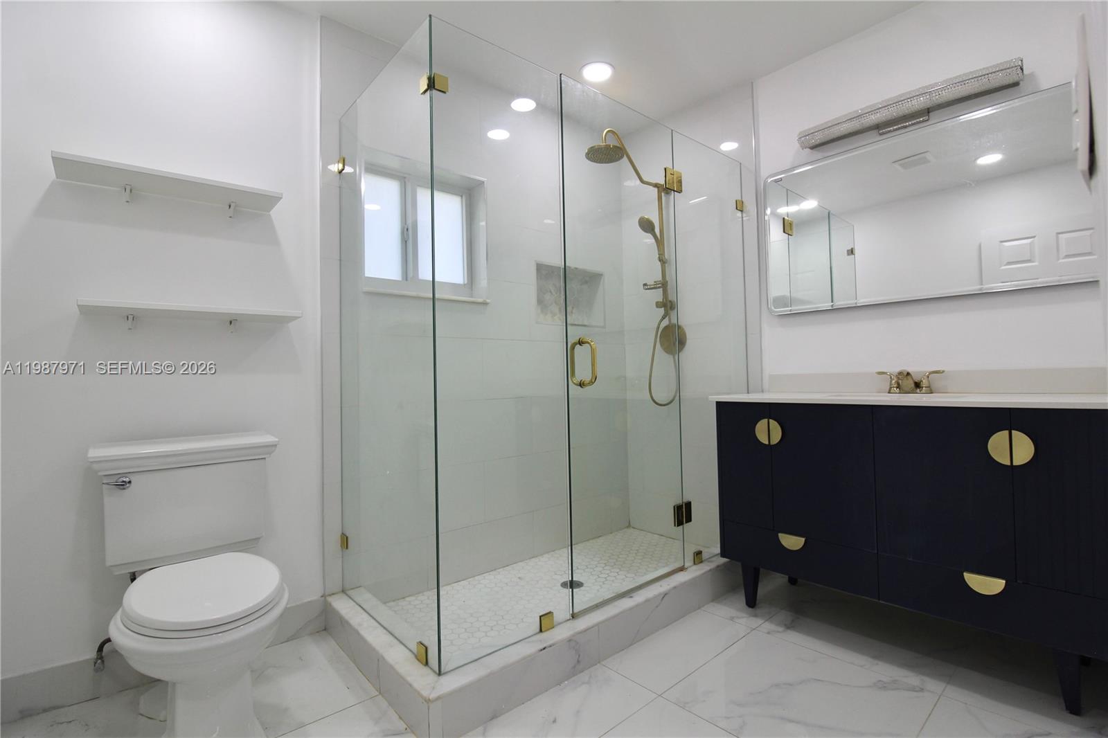 5160 Southwest 8th Street Margate, FL 33068 - Photo 5 of 23 a bathroom with a shower a toilet and sink