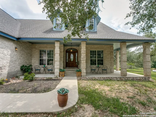 a front view of a house with garden