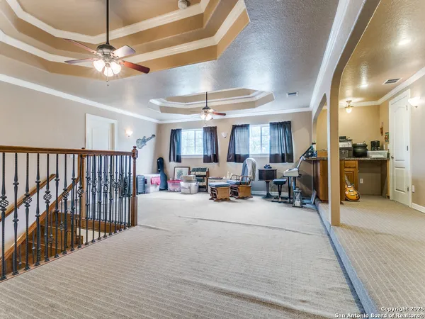 a view of a livingroom with furniture and a chandelier