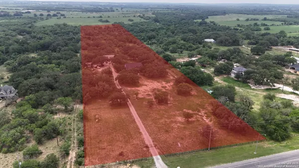 an aerial view of house with yard