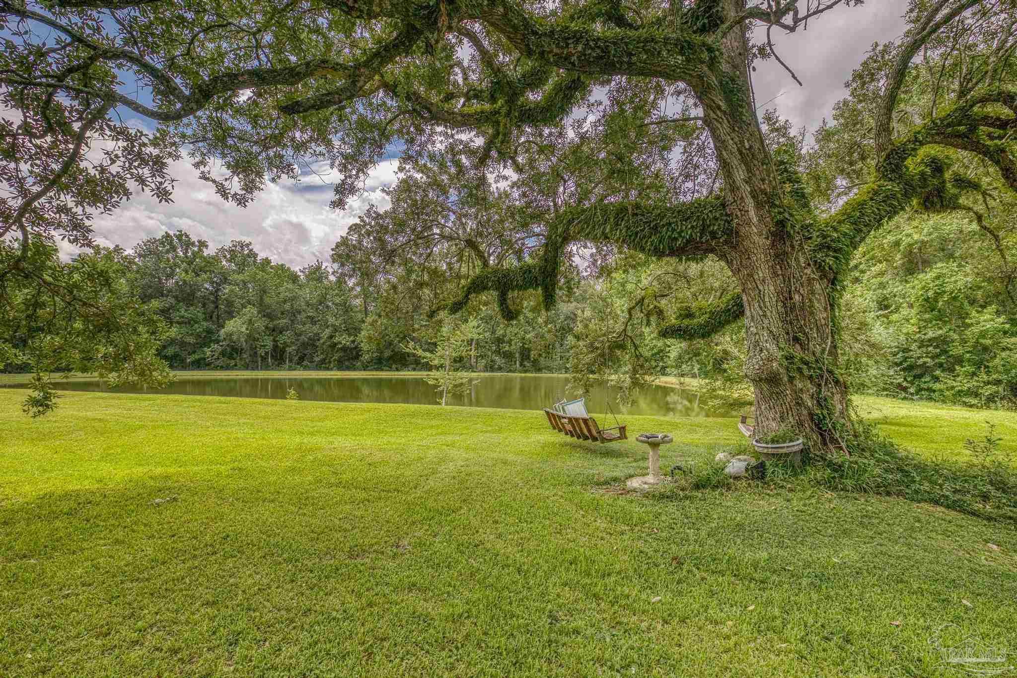 2345 Pompano Street Cantonment, FL 32533 - Photo 11 of 48 a view of an outdoor space and a yard