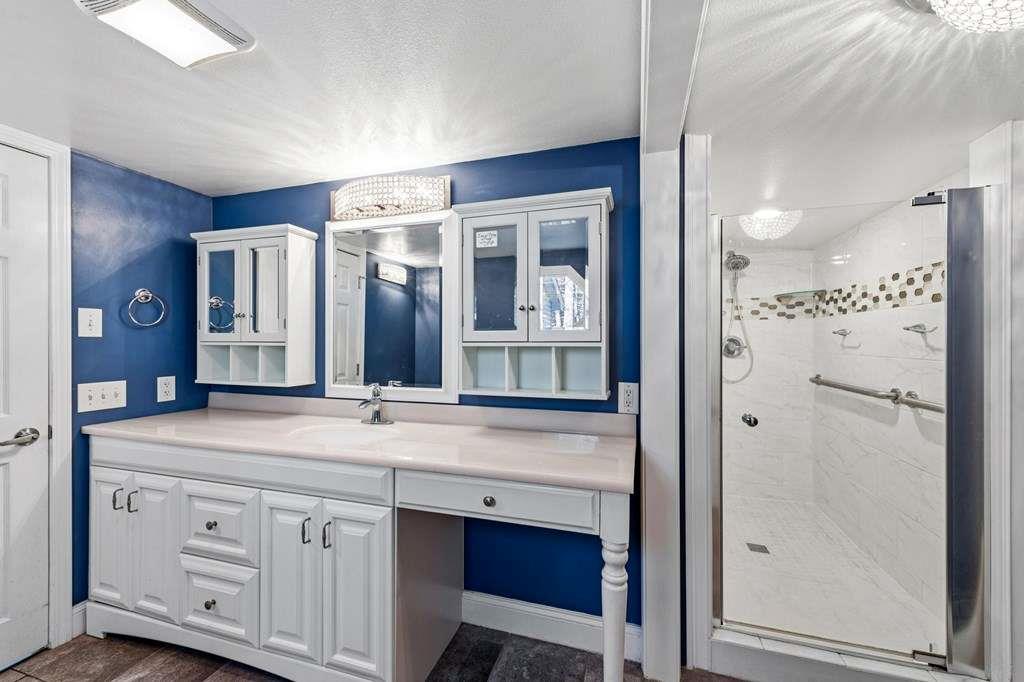 118 Jordan Road Blairsville, GA 30512 - Photo 25 of 49 a bathroom with a double vanity sink and mirror