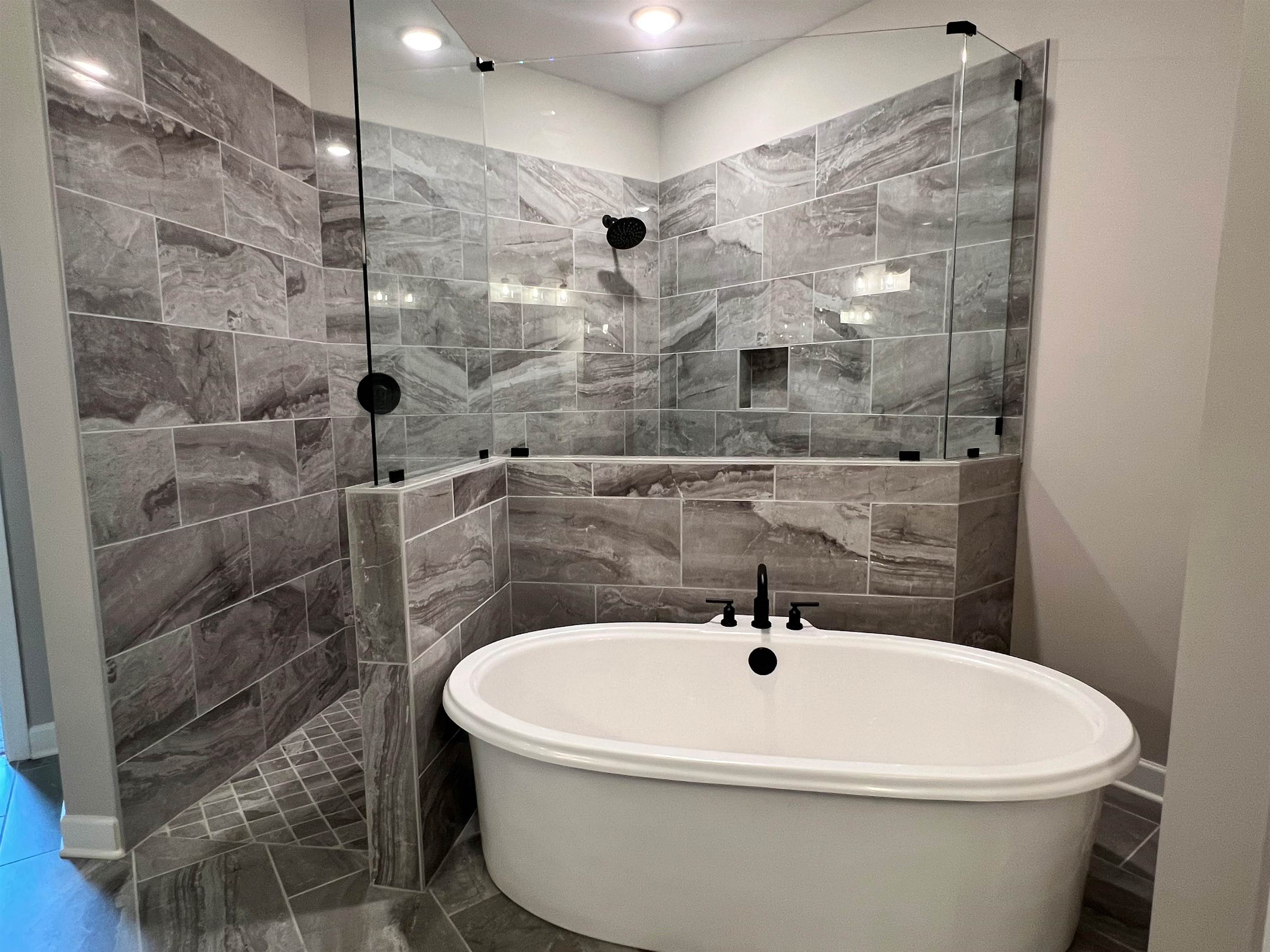 220 Drake Drive Collierville, TN 38017 - Photo 11 of 30 a white bath tub sitting in a bathroom and shower