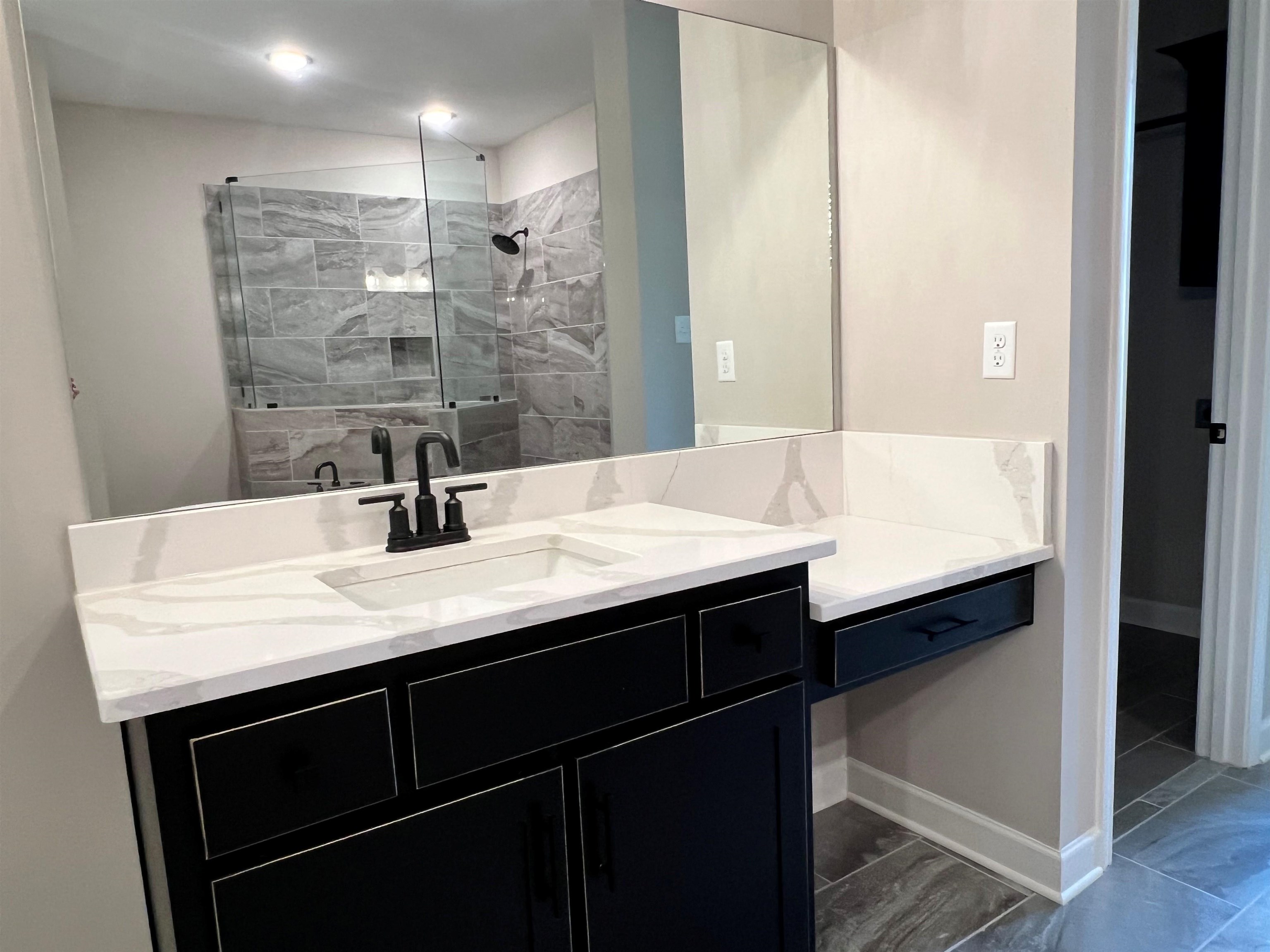 220 Drake Drive Collierville, TN 38017 - Photo 12 of 30 a bathroom with a sink and a mirror