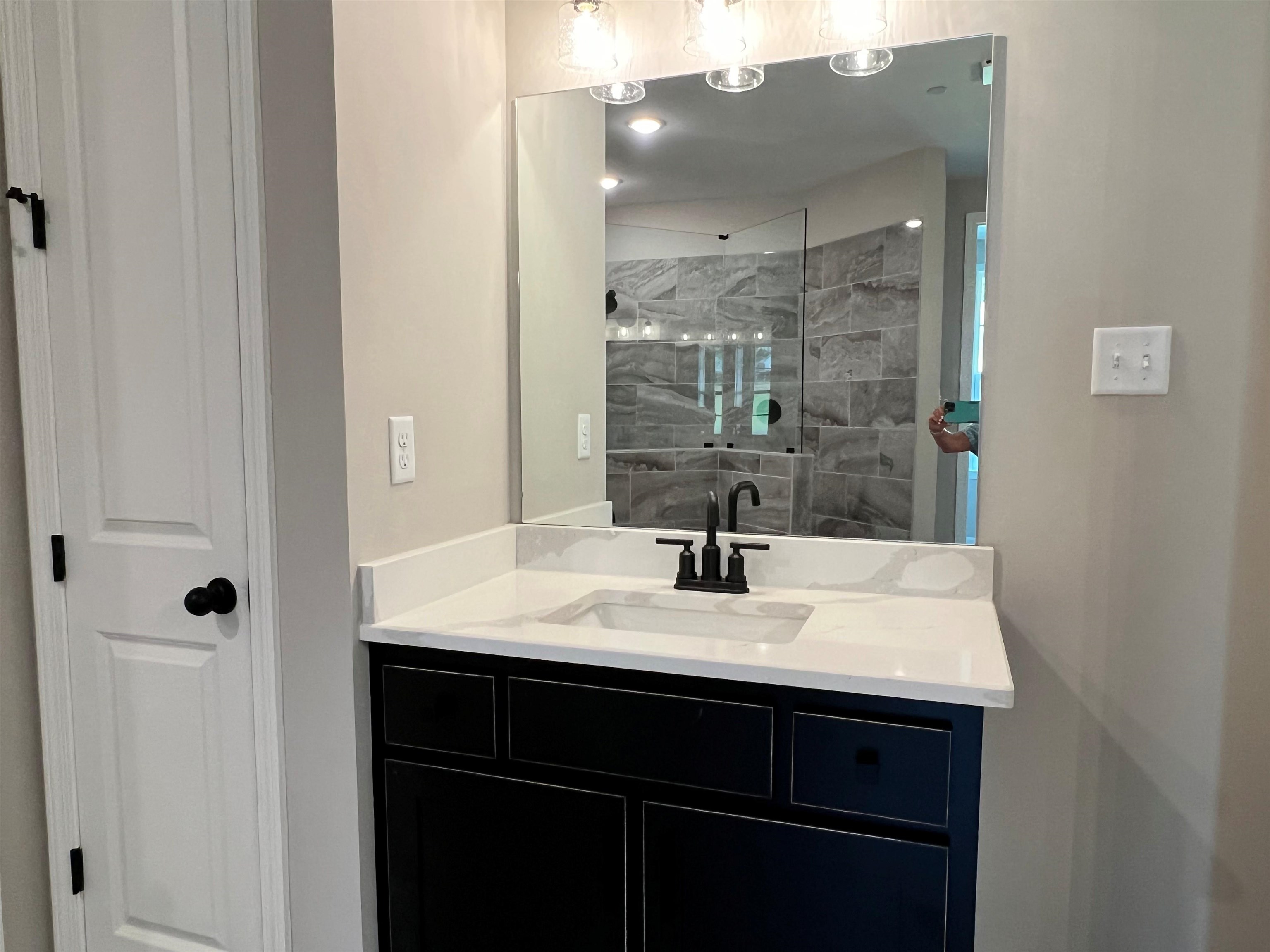 220 Drake Drive Collierville, TN 38017 - Photo 13 of 30 a bathroom with a sink a vanity and a mirror
