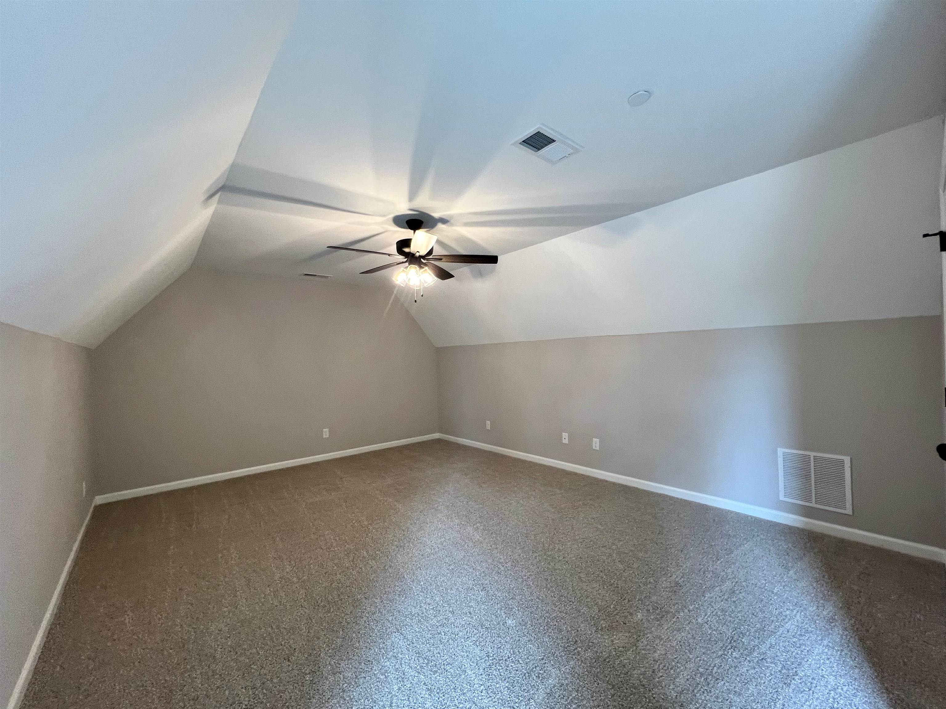 220 Drake Drive Collierville, TN 38017 - Photo 22 of 30 a view of an empty room with a fan