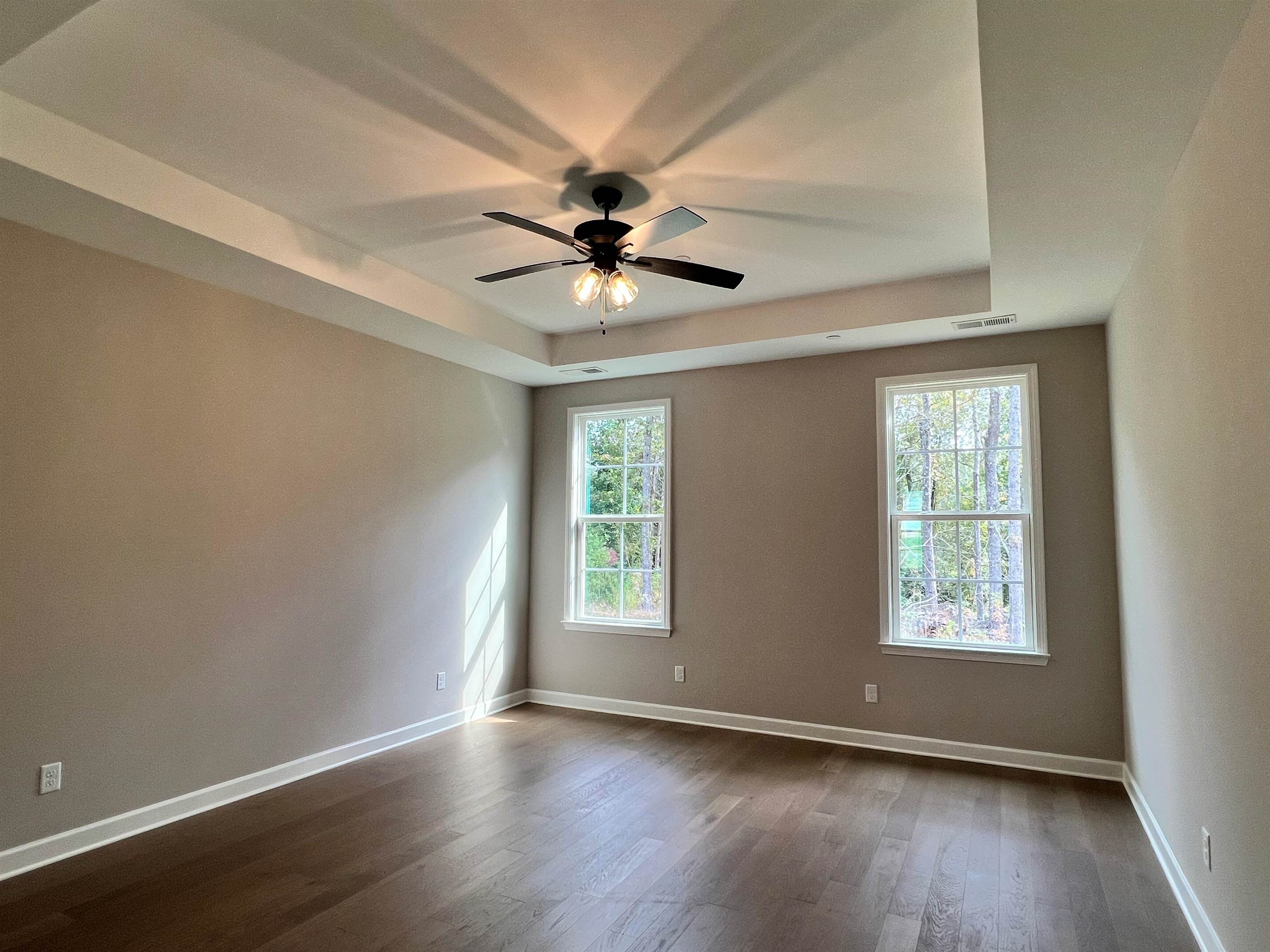 220 Drake Drive Collierville, TN 38017 - Photo 10 of 30 a view of an empty room with window and wooden floor