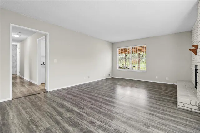 a view of a livingroom with wooden floor