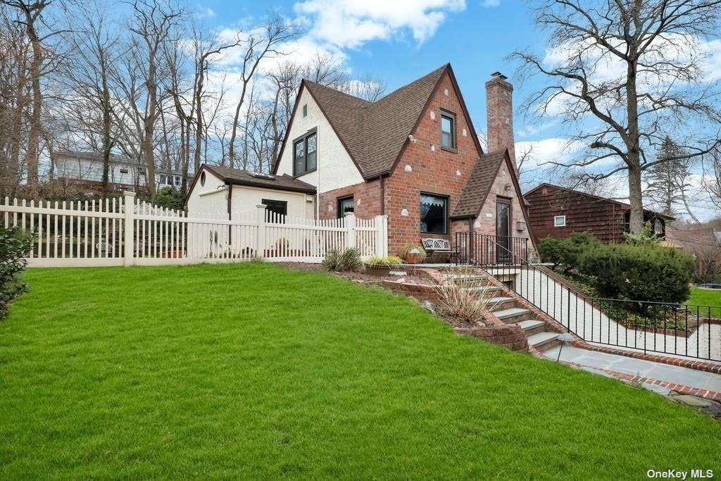 5 West Terrace Road Great Neck, NY 11021 - Photo 1 of 1 a front view of house with yard and green space