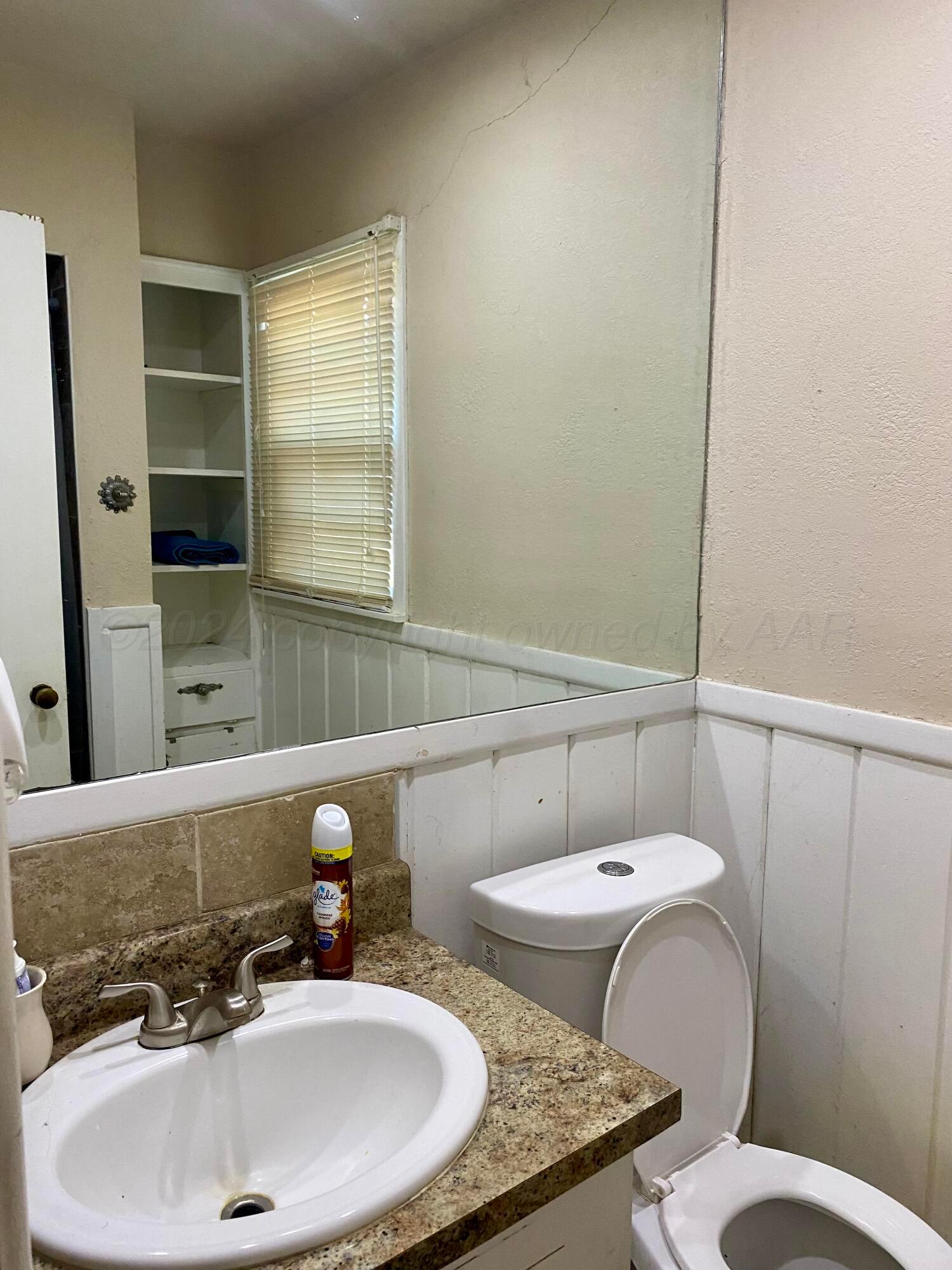 3309 Paramount Boulevard Amarillo, TX 79109 - Photo 16 of 26 a bathroom with a sink and a toilet