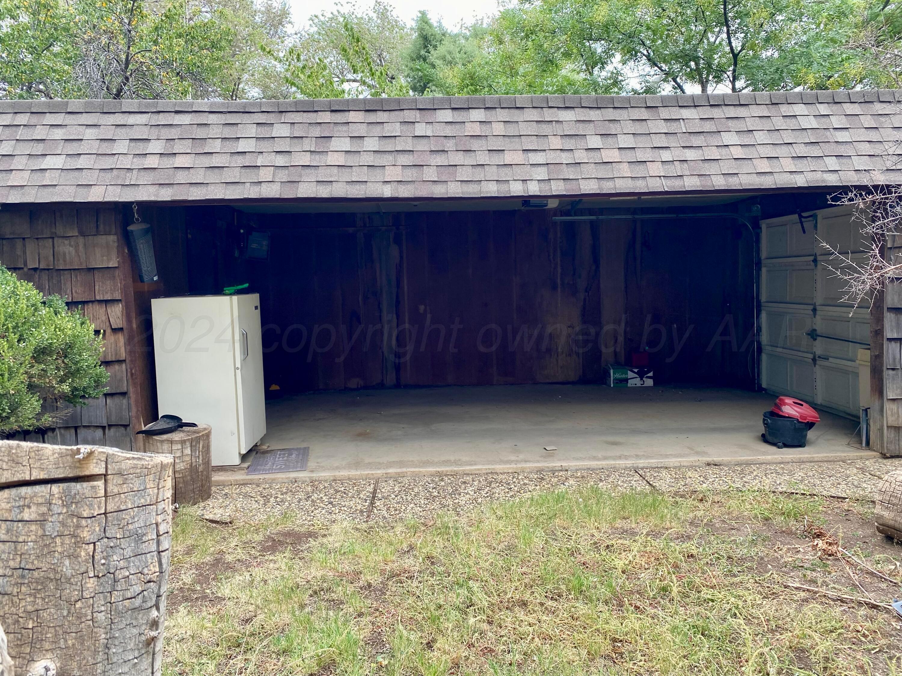 3309 Paramount Boulevard Amarillo, TX 79109 - Photo 21 of 26 a view of backyard with brick wall and wall