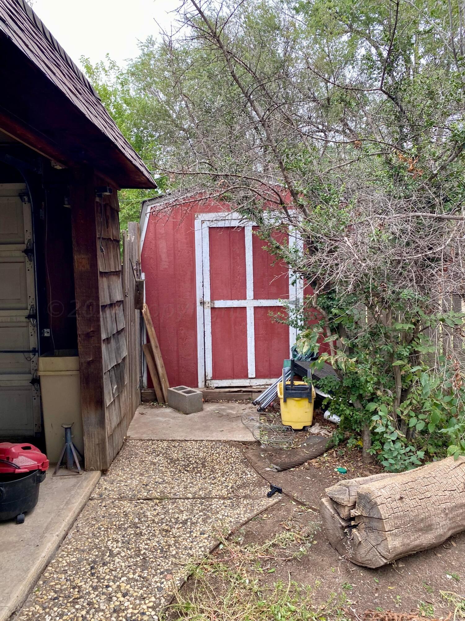 3309 Paramount Boulevard Amarillo, TX 79109 - Photo 25 of 26 a front view of a house with a yard