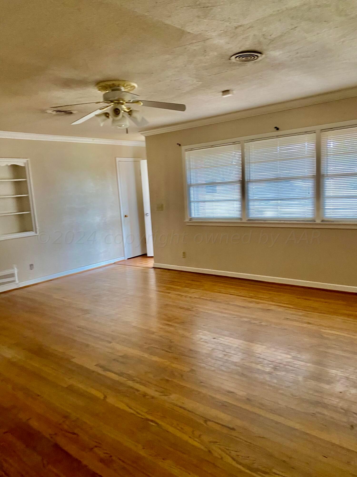 3309 Paramount Boulevard Amarillo, TX 79109 - Photo 4 of 26 a view of a room with wooden floor