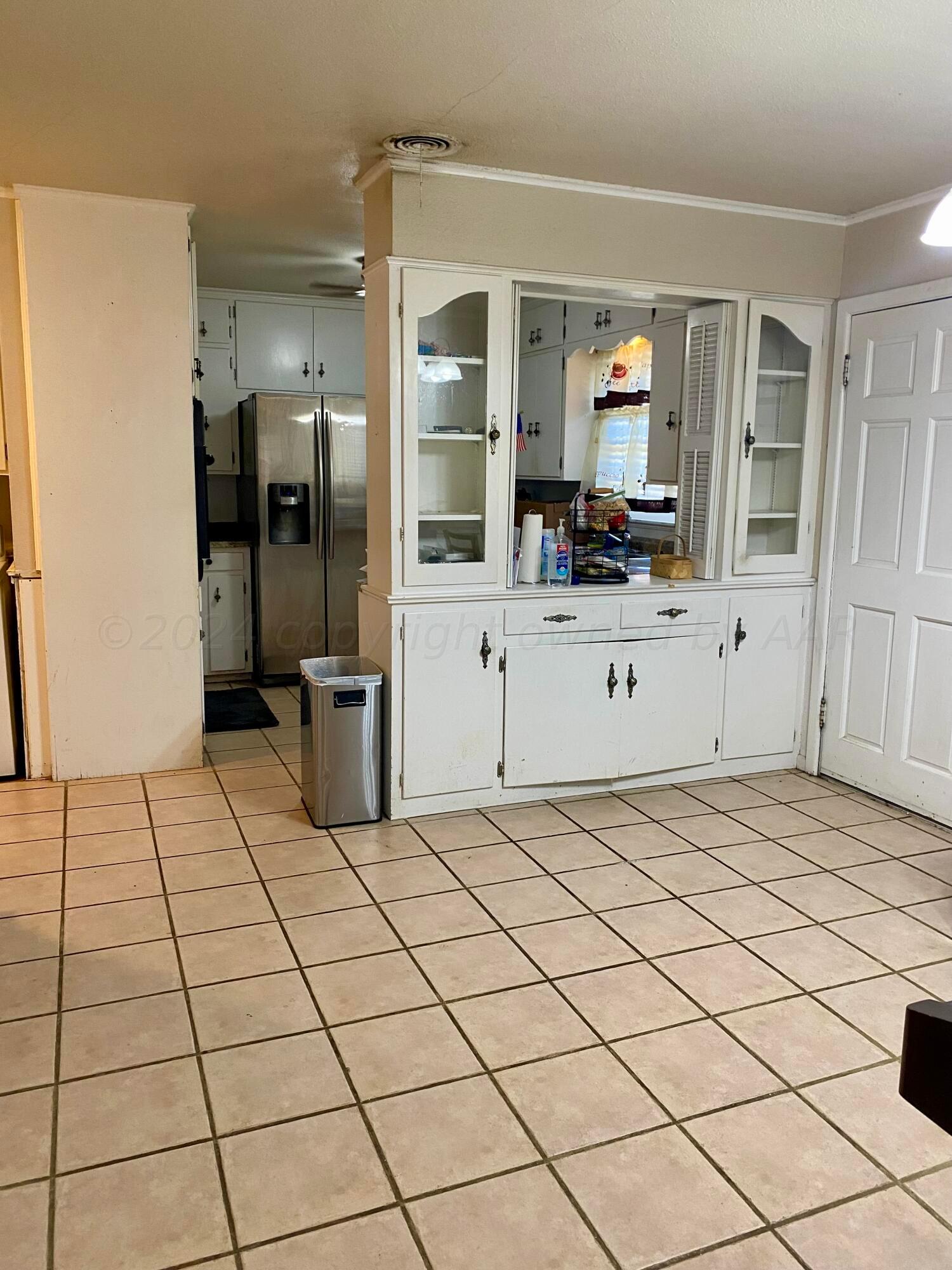3309 Paramount Boulevard Amarillo, TX 79109 - Photo 7 of 26 a kitchen with stainless steel appliances a refrigerator and a sink