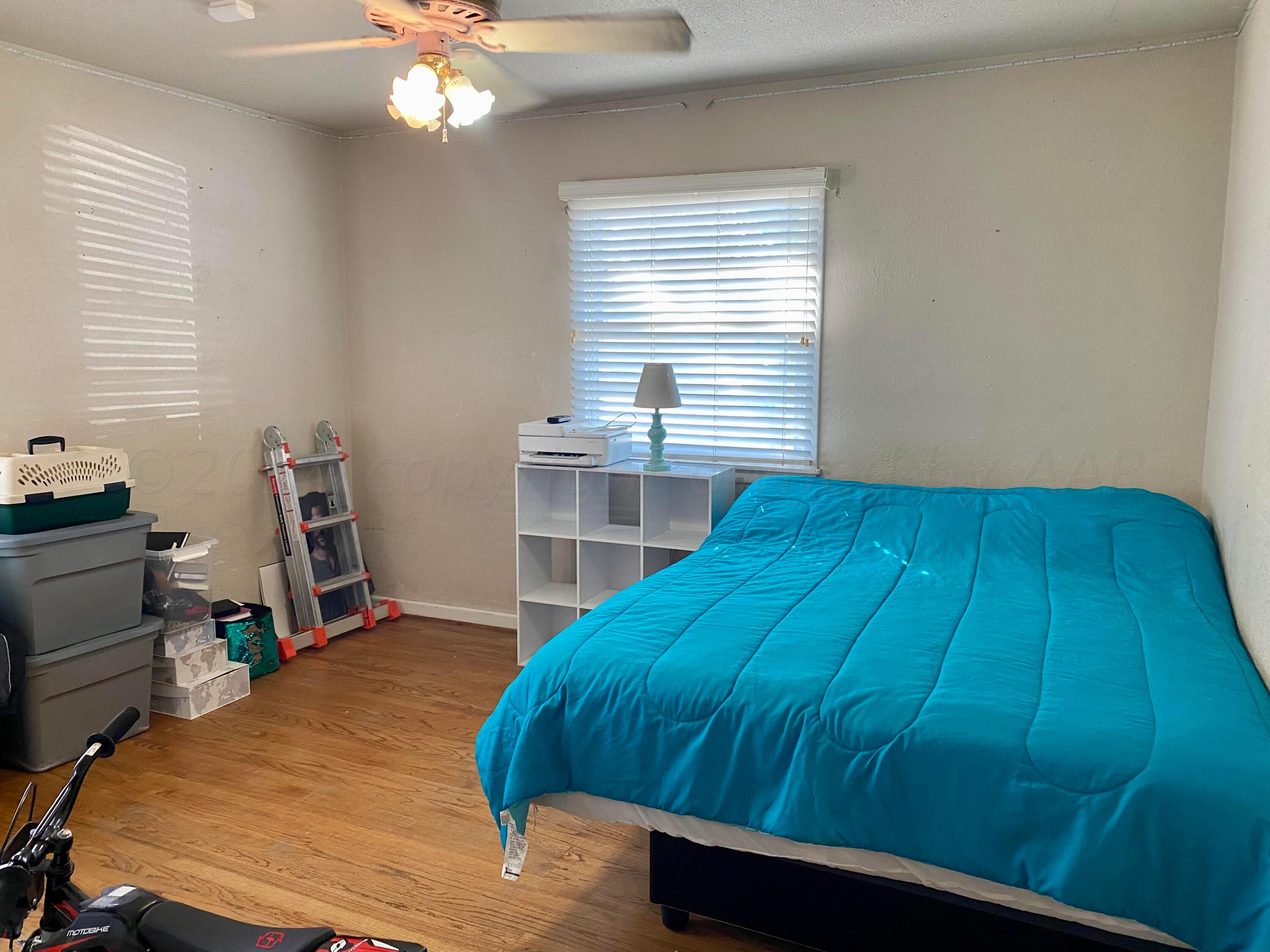 3309 Paramount Boulevard Amarillo, TX 79109 - Photo 10 of 26 a bedroom with a bed and a window
