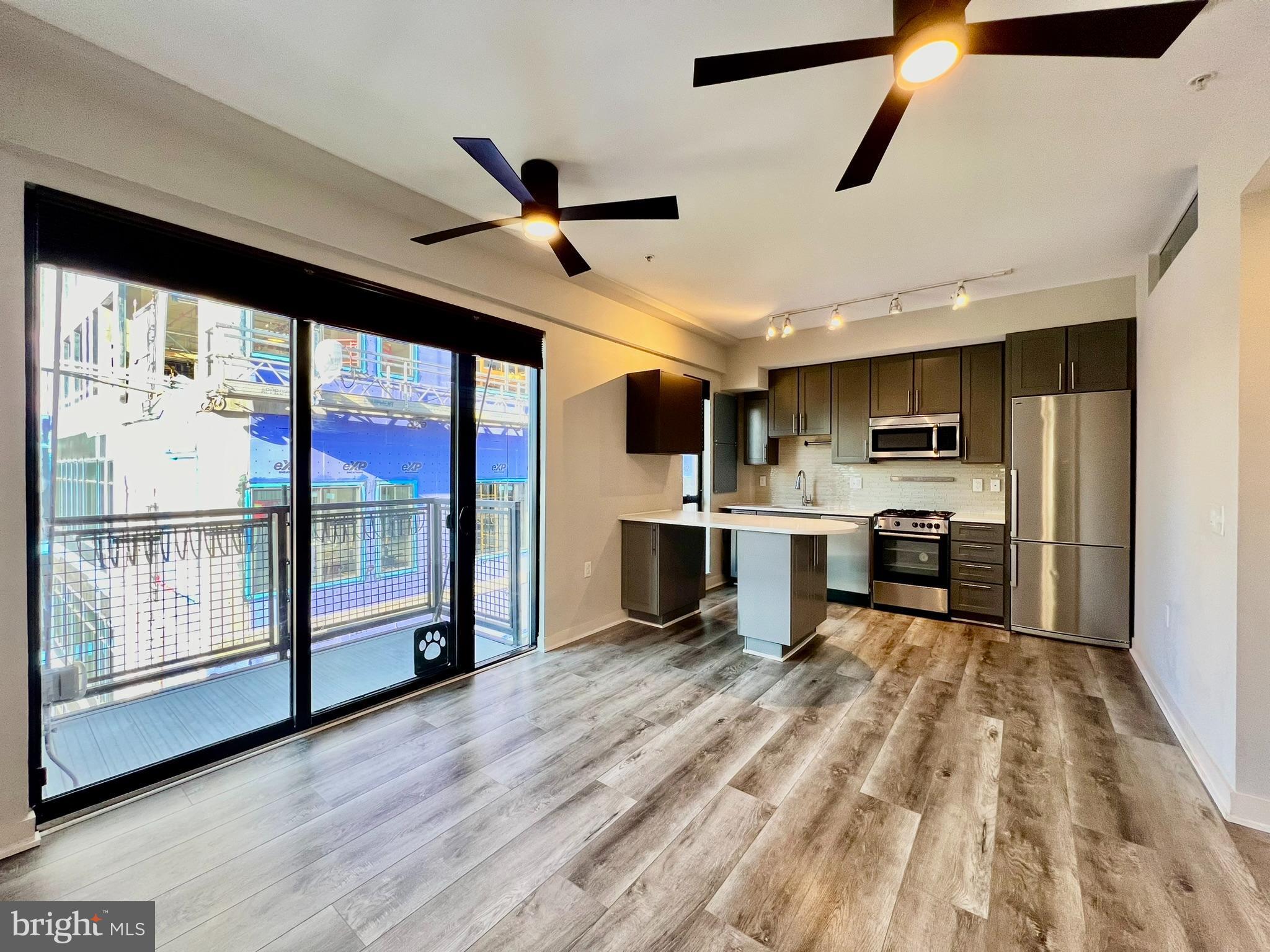 1320 Fenwick Lane, Unit 808 Silver Spring, MD 20910 - Photo 5 of 29 Living room & kitchen