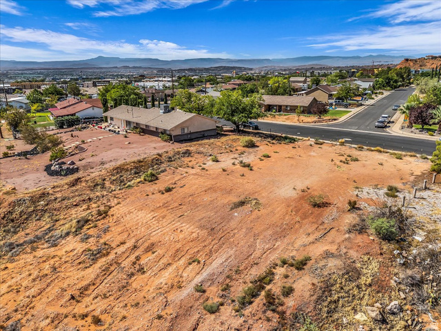 446 Quail Drive Washington, UT 84780 - Photo 2 of 12 Expansive undeveloped land featuring a desert landscape with natural rock formations and distant mountain scenery