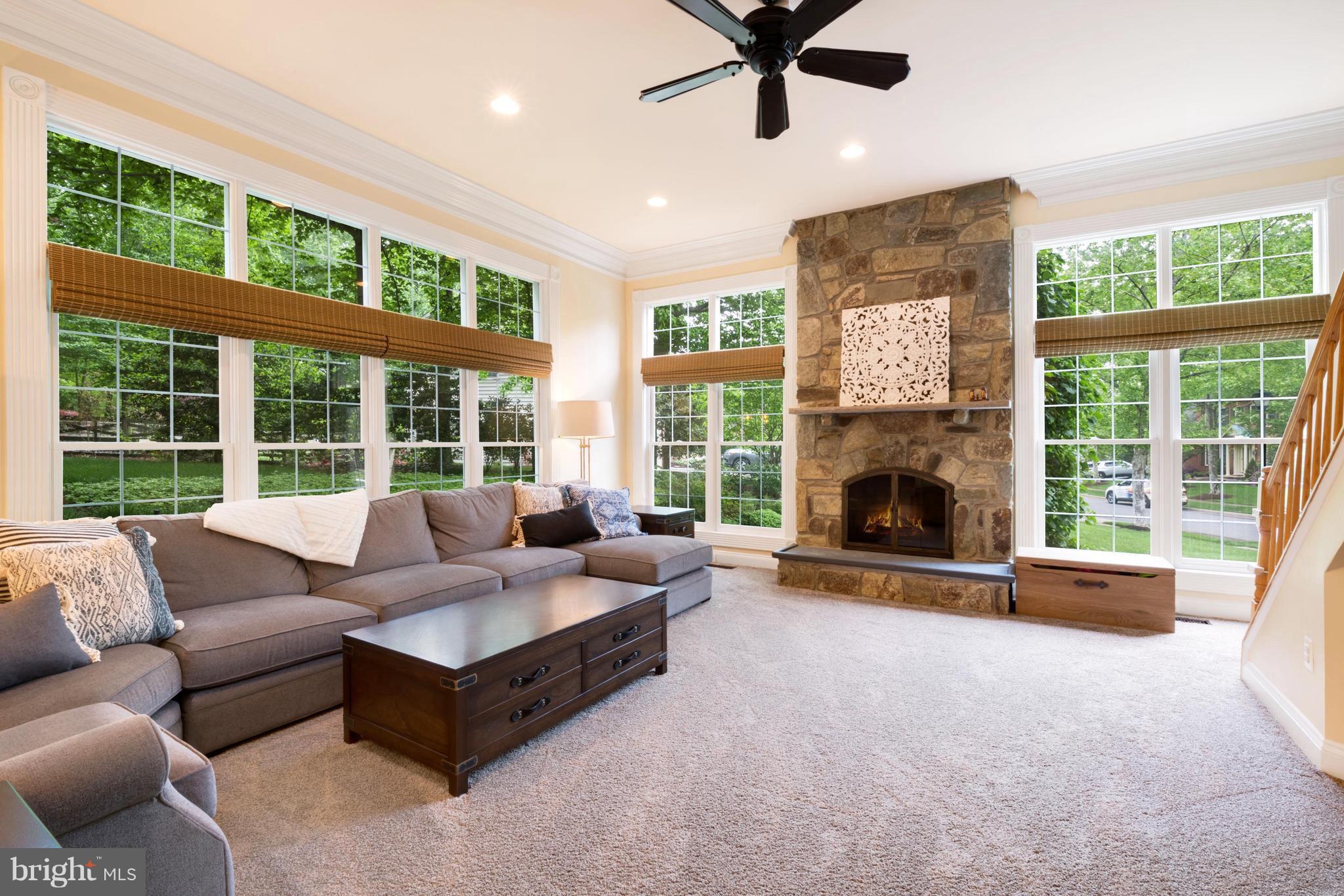 Family Room w stone gas  FP, & rear stairs.