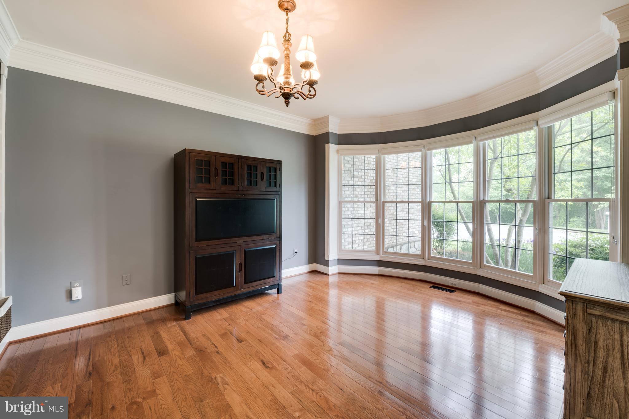 Main level office  w/ gleaming HW floors.