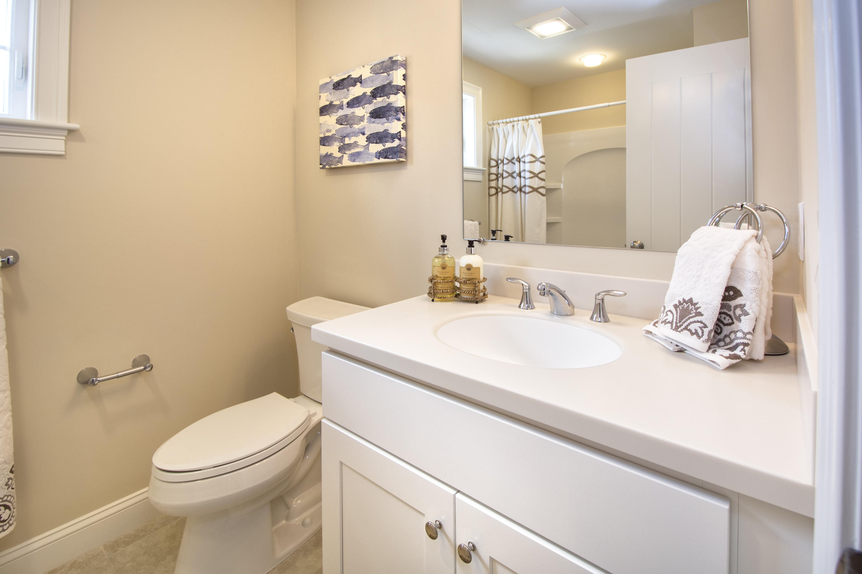 67 Cottage Lane Mashpee, MA 02649 - Photo 16 of 31 a bathroom with a sink a toilet and a mirror