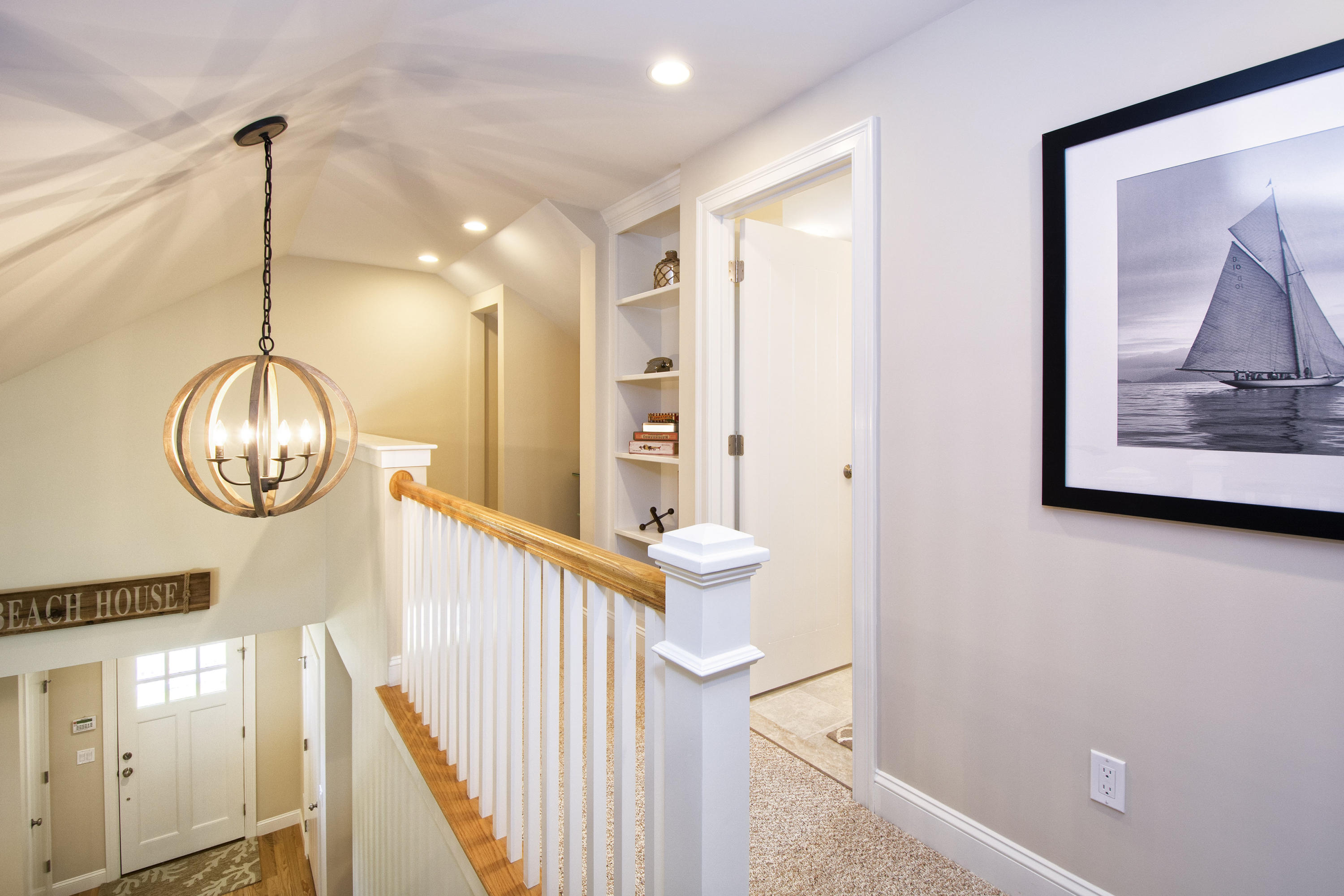 67 Cottage Lane Mashpee, MA 02649 - Photo 17 of 31 a view of a hallway with wooden floor and staircase