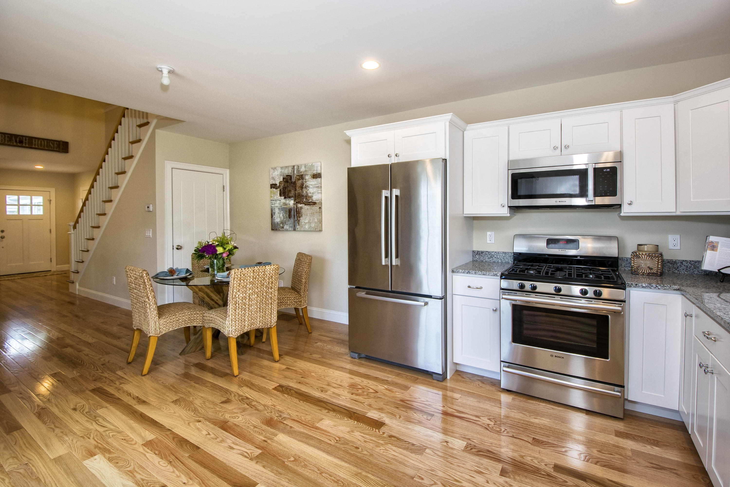 67 Cottage Lane Mashpee, MA 02649 - Photo 7 of 31 a kitchen with stainless steel appliances a stove a sink refrigerator and microwave